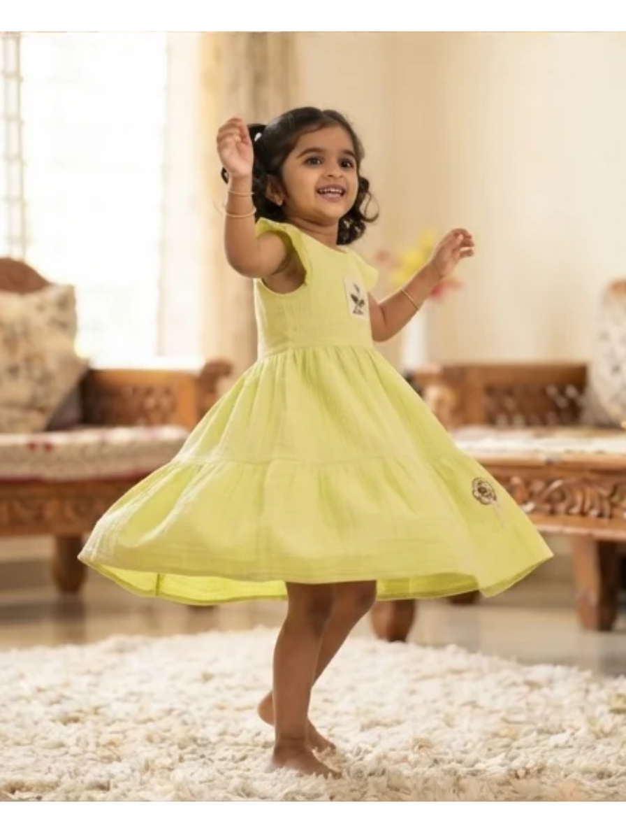 Charming Pastel Green Tiered Cotton Dress with Ruffle Sleeves and Floral Applique